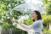 Happy woman in rain