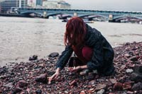 Woman beachcombing